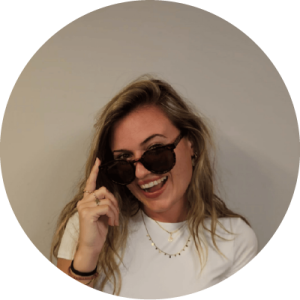 Woman with hand raised thoughtfully.